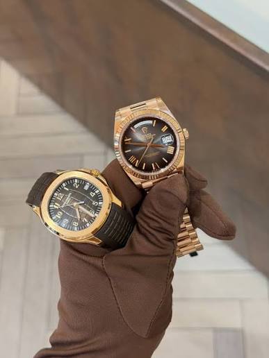 Two gold watches from stock at Kettle Club, Liverpool Street London